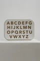 Tablica grafomotoryczna - literki białe. Materiały edukacyjne Babywood (1).webp
